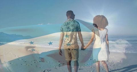 Couple walking hand in hand on sunlit beach with honduras flag double exposure overlay