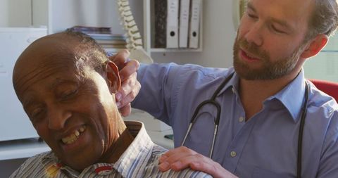 Doctor Conducts Careful Examination at Retirement Home