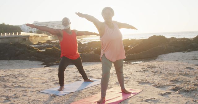 Happy Senior African American Couple Doing Yoga on Sunny Beach at Sunset - Download Free Stock Images Pikwizard.com