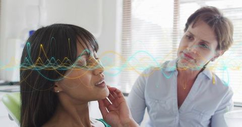 Patient consulting clinician with color waveform overlay for telemedicine facial health analysis