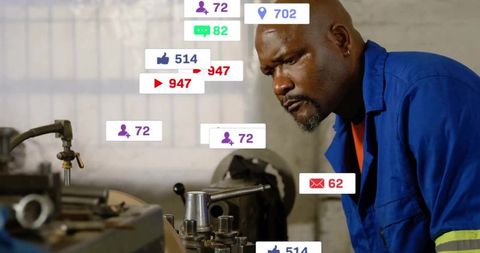 Machinist leaning over lathe adjusting controls with augmented social hud notifications
