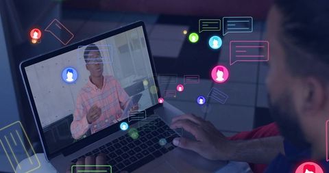 Man typing on laptop during remote meeting with presenter holding tablet and chat overlays