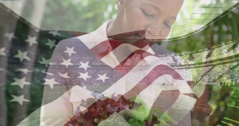 Holding salad bowl and lifting fork on porch with american flag and stadium overlay