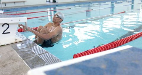 Athlete Preparing for Swimming Drill in Indoor Pool - Download Free Stock Images Pikwizard.com