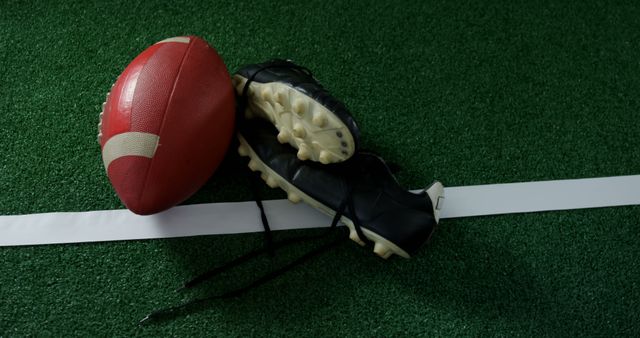 Football and Cleats on Field with White Line - Download Free Stock Images Pikwizard.com