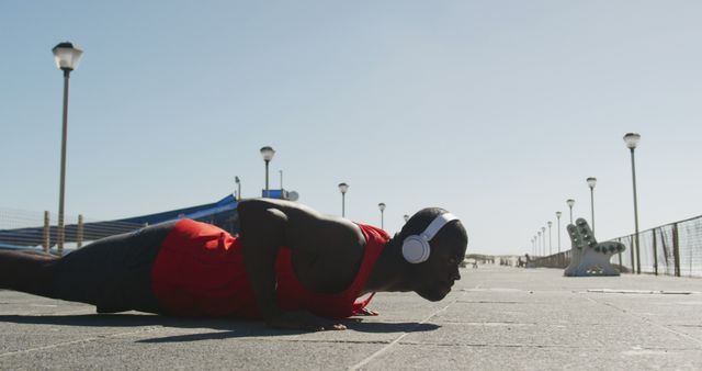 African American Man Doing Outdoor Push-Ups Listening to Music - Download Free Stock Images Pikwizard.com