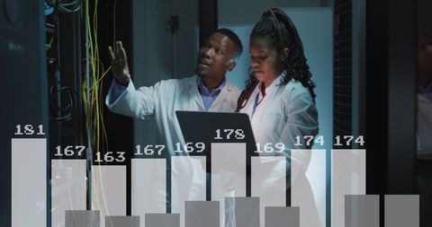 IT Engineers Analyzing Server Data in Computer Room - Download Free Stock Images Pikwizard.com