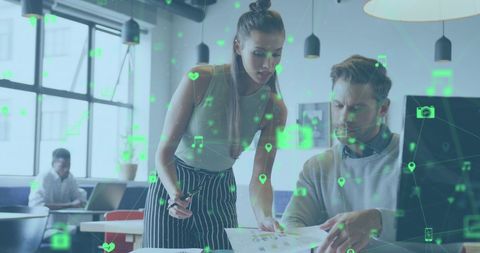 Professionals Analyzing Digital Data in Modern Office