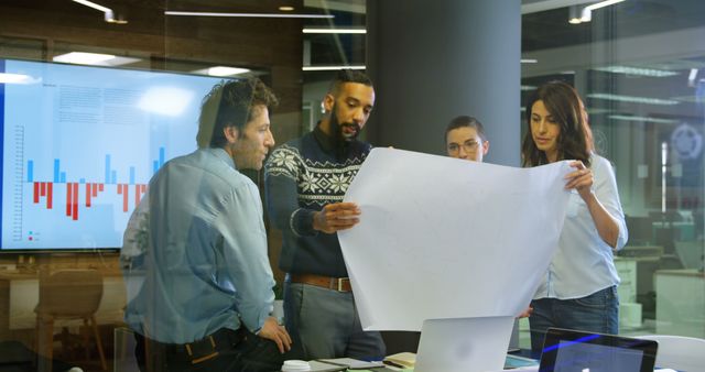 Team Collaborating on Project Blueprint in Modern Office - Download Free Stock Images Pikwizard.com