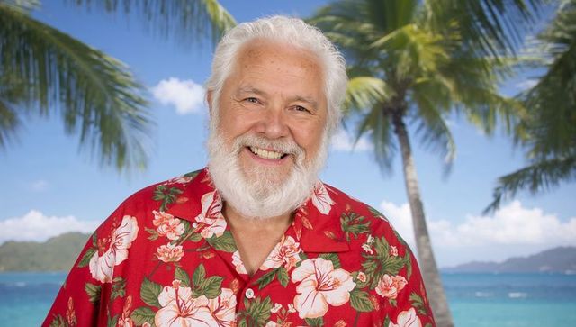 Senior man in hawaiian shirt enjoying relaxing beach day