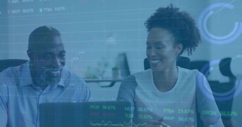 Coworkers Analyzing Financial Data on Laptop with Transparency Effect