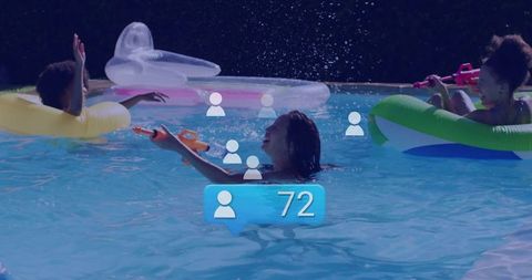 Joyful Friends Playing with Water Pistols in Summer Pool