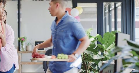 Office Colleagues Celebrating Birthday with Cake and Balloons