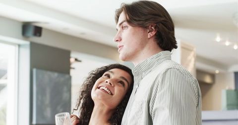 Couple Enjoying Celebration Together with Champagne at Party