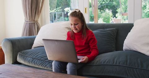 Happy Girl Using Laptop on Couch at Home - Download Free Stock Images Pikwizard.com