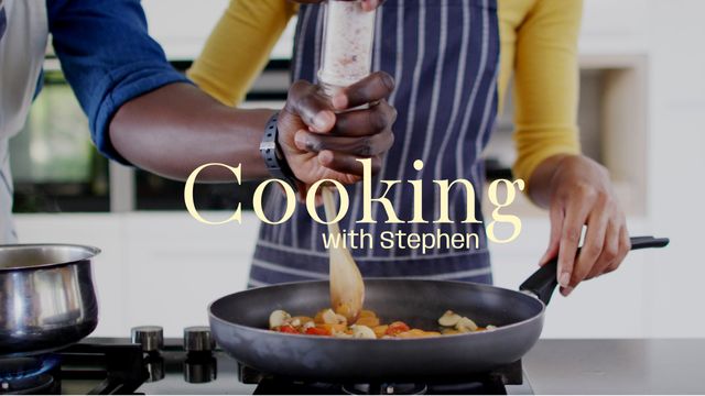 This image depicts a couple seasoning and cooking a meal together in a modern kitchen. Perfect for content related to culinary arts, healthy eating, teamwork in the kitchen, or cooking tutorials. Great for blogs, social media posts, cookbooks, or advertisements aimed at promoting cooking classes or kitchenware.