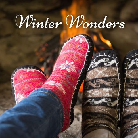 Couple relaxing with cozy socks by fireplace