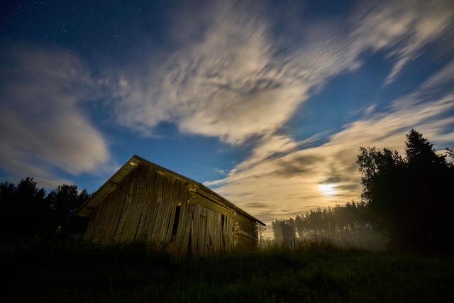 Dilapidated Wooden House Under Starry Sky with Full Moon and Clouds - Download Free Stock Photos Pikwizard.com