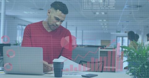Business professional analyzing data with futuristic overlay