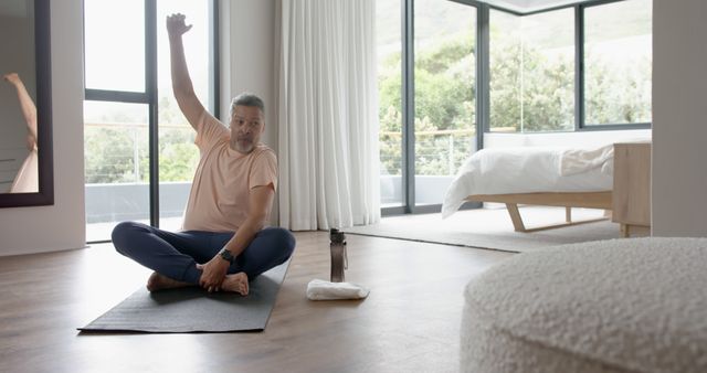 Middle-aged man stretching during morning yoga session at home - Download Free Stock Images Pikwizard.com