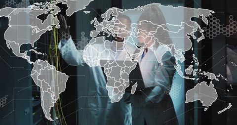 Network Engineers Analyzing Data in High-Tech Data Center