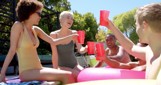 Group of Friends Enjoying a Pool Party with Red Cups - Download Free Stock Images Pikwizard.com