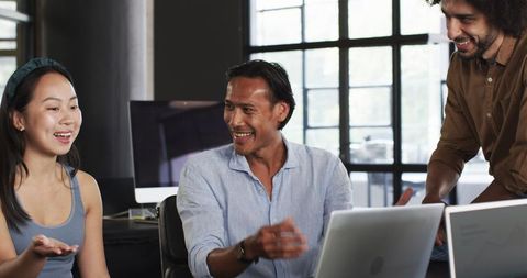 Diverse Office Team Engaging in Productive Meeting Collaboration