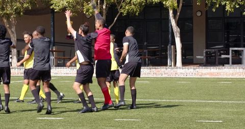 Soccer players celebrating goal with team spirit and excitement