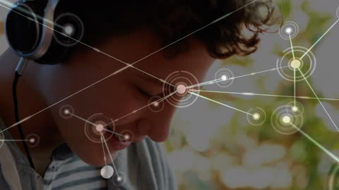 Caucasian Student Using Headphones with Conceptual Network Overlay