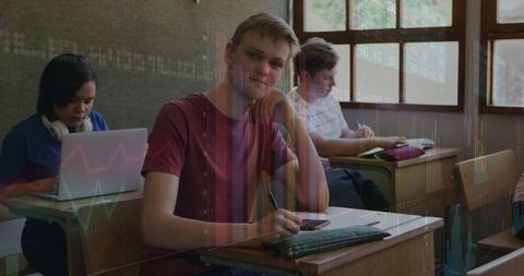High School Student Studying with Laptop and Smartphone in Classroom, Data Analytics Overlay
