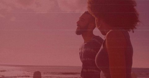 Couple Strolling Beachfront at Sunset with Serene Vibes