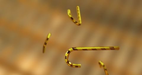 Golden candy canes falling in festive celebration