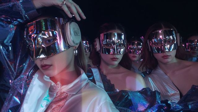 Futuristic Group Performance in Metallic Costumes and Masks
