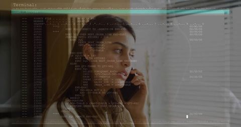 Businesswoman Holding Phone by Office Window with Coding Terminal Overlay Showing Analytics