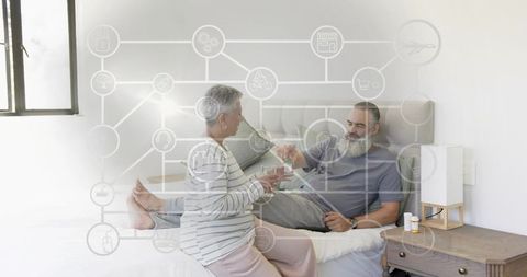 Senior couple sharing medication in bed with smart home iot overlay for home care