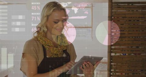 Cafe owner holding tablet scanning analytics dashboard with ar charts and wooden interior