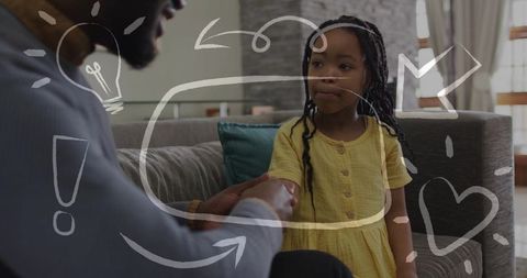 African american caregiver holding young girl on couch, bonding with doodle overlay