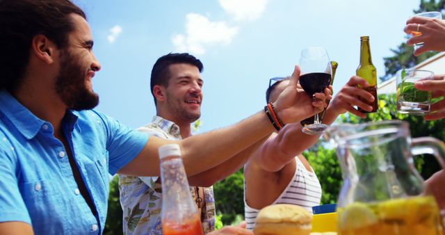 Friends Celebrating Outdoors with Drinks on a Sunny Day - Download Free Stock Images Pikwizard.com