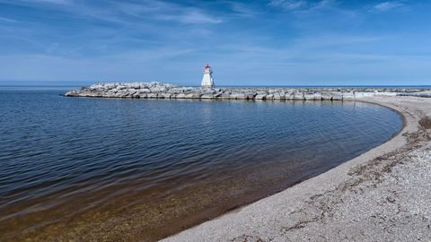 Tranquil Lakeside View with Iconic Lighthouse