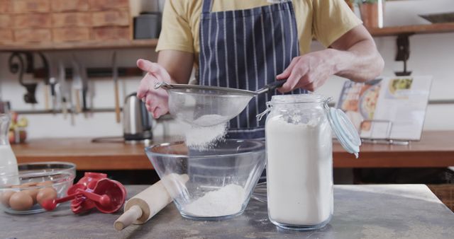 Baker Sifting Flour into Bowl in Rustic Kitchen - Download Free Stock Images Pikwizard.com