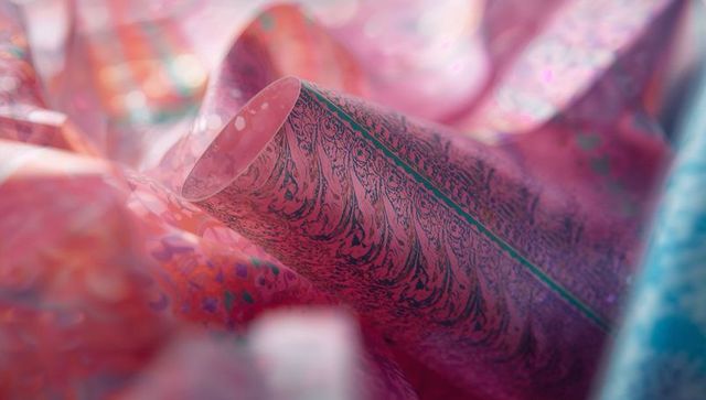 Colorful marbled art design on paper roll in craft workshop