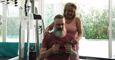 Senior Couple Enjoying Home Workout Together in Gym