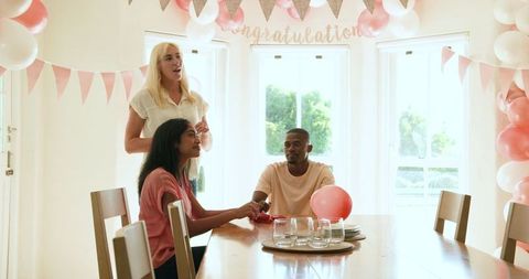Multiracial friends preparing for festive celebration