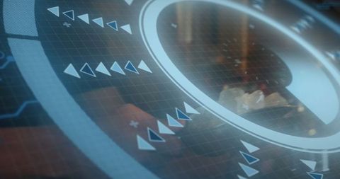 Futuristic circle interface overlay on desk with digital elements