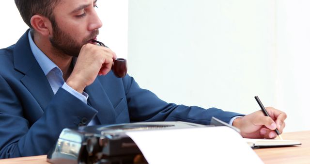 Businessman Thinking While Writing Notes with Pipe and Typewriter - Download Free Stock Images Pikwizard.com