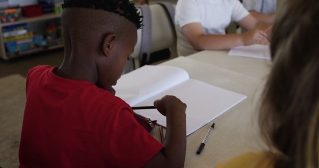 Children Focusing on Schoolwork at Classroom Desk - Download Free Stock Images Pikwizard.com