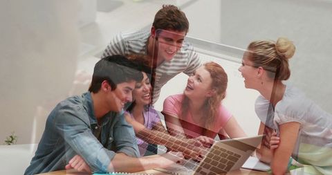 Student Group Collaborating in Study Lounge with Laptops