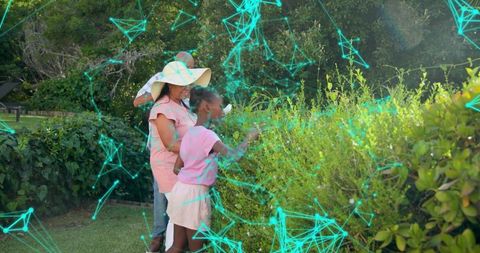 Grandparents Guiding Child Exploring Garden Hedge with Futuristic Cyan Network Overlay