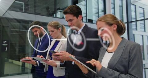 Business Team Utilizing Digital Devices with Media Icons Overlay