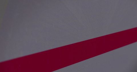 Abstract digital light trails with glitch effect over red banner